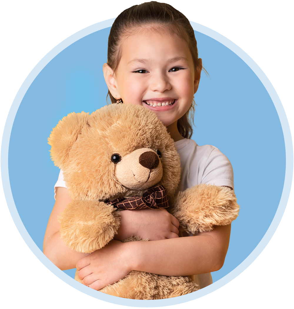 Photo of a kid with a teddy bear