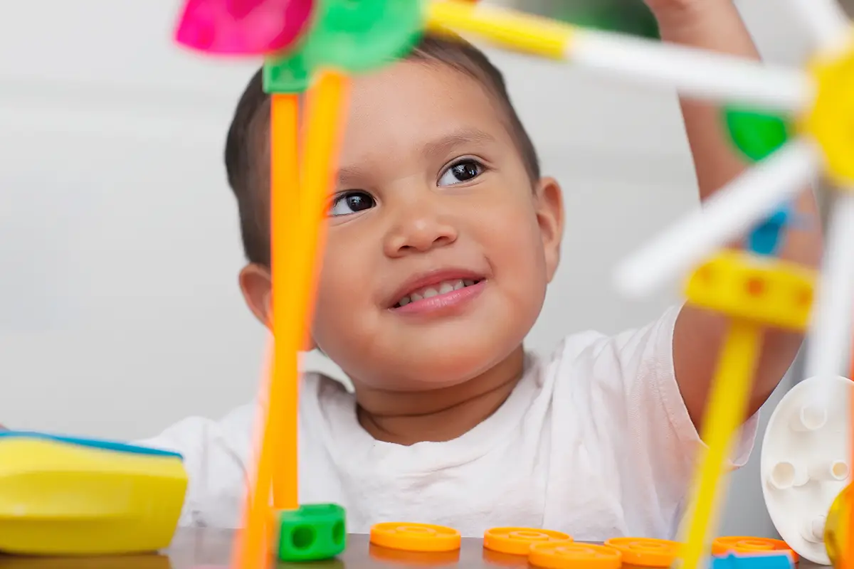Photo of kid with building set