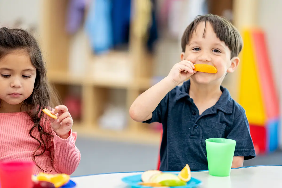 Photo of kid eating snacks