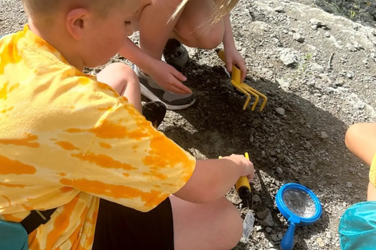 Photo of kids playing in the dirt